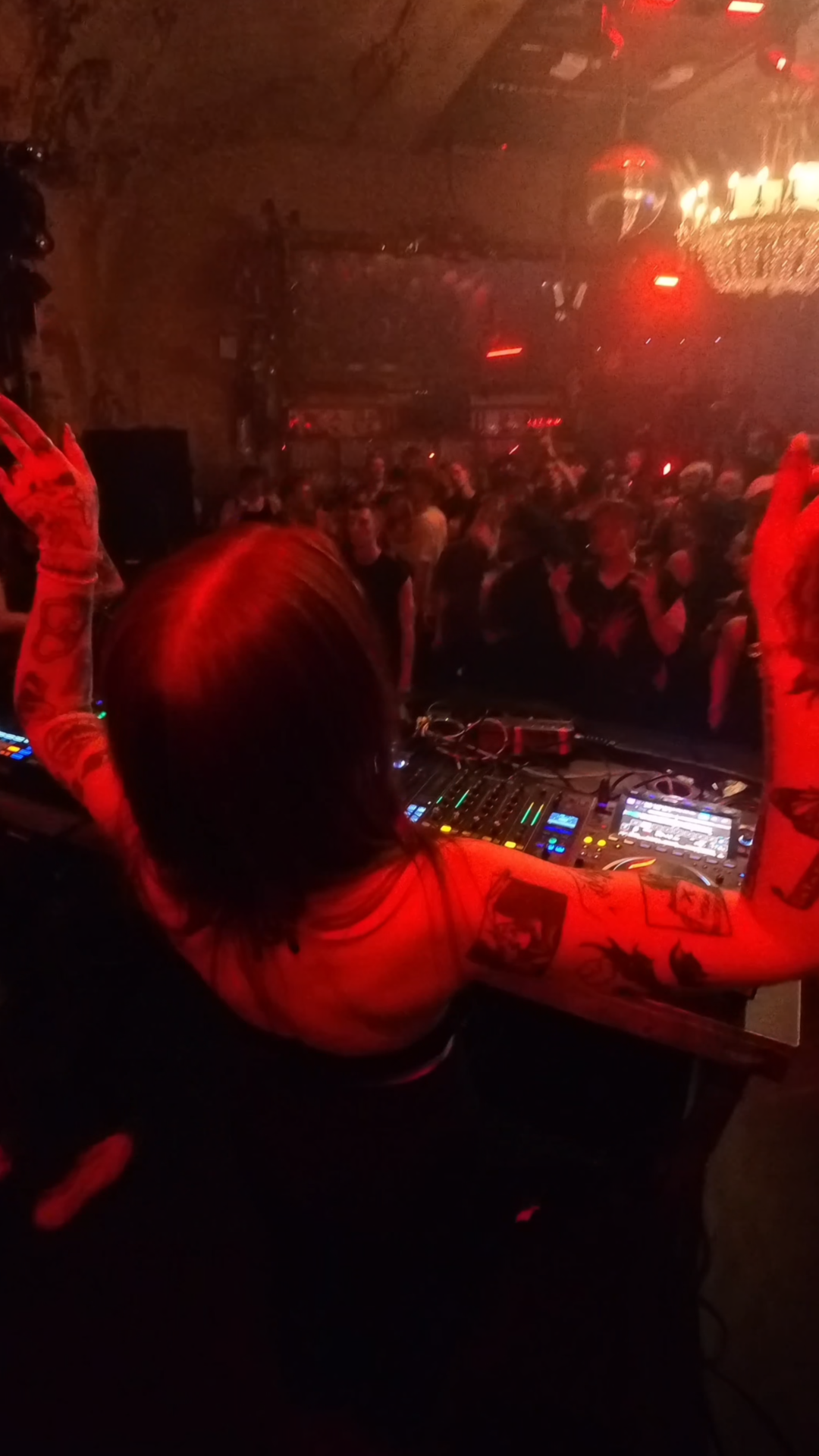 Dark warehouse party with laser beams