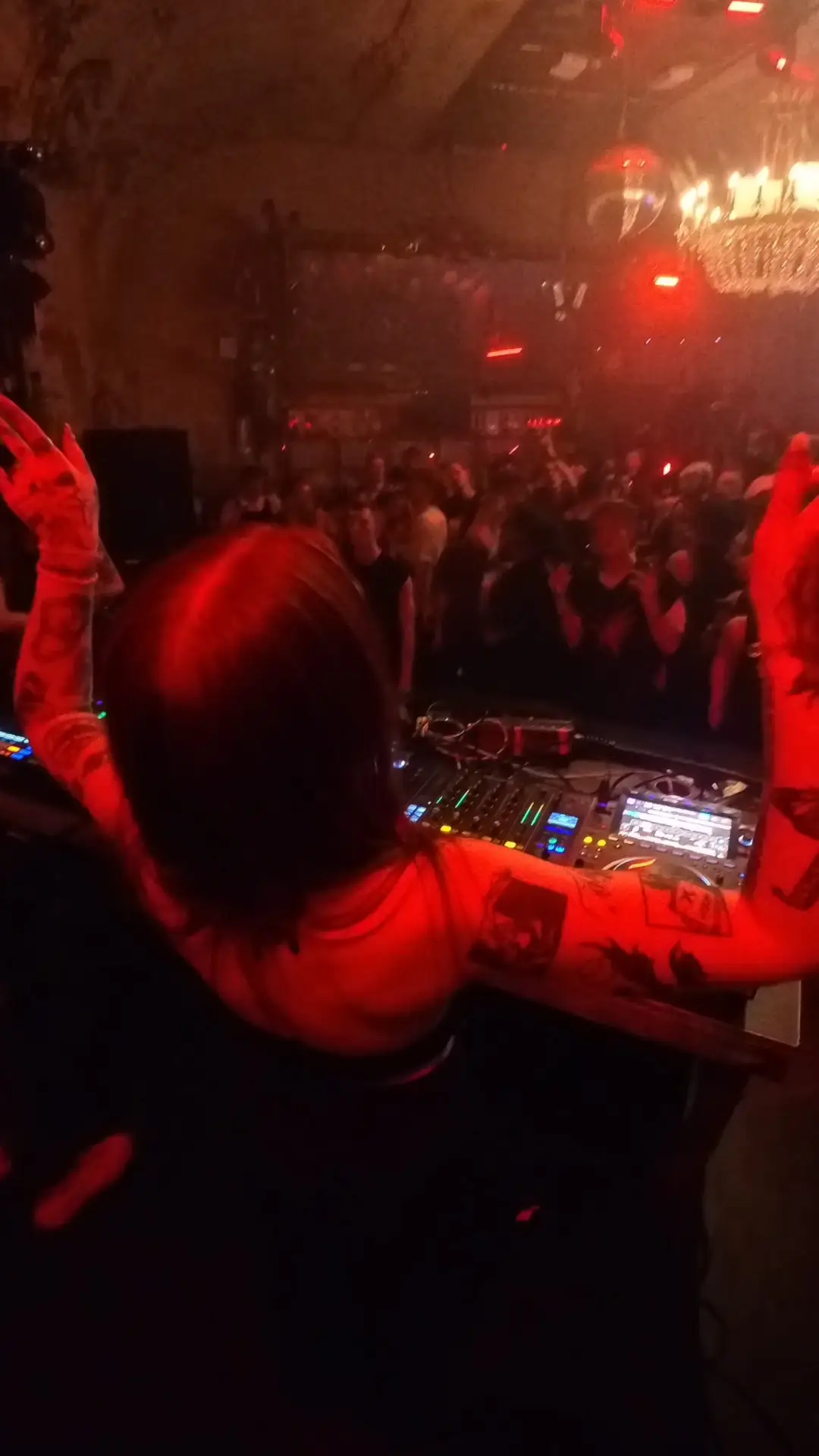 Dark warehouse party with laser beams