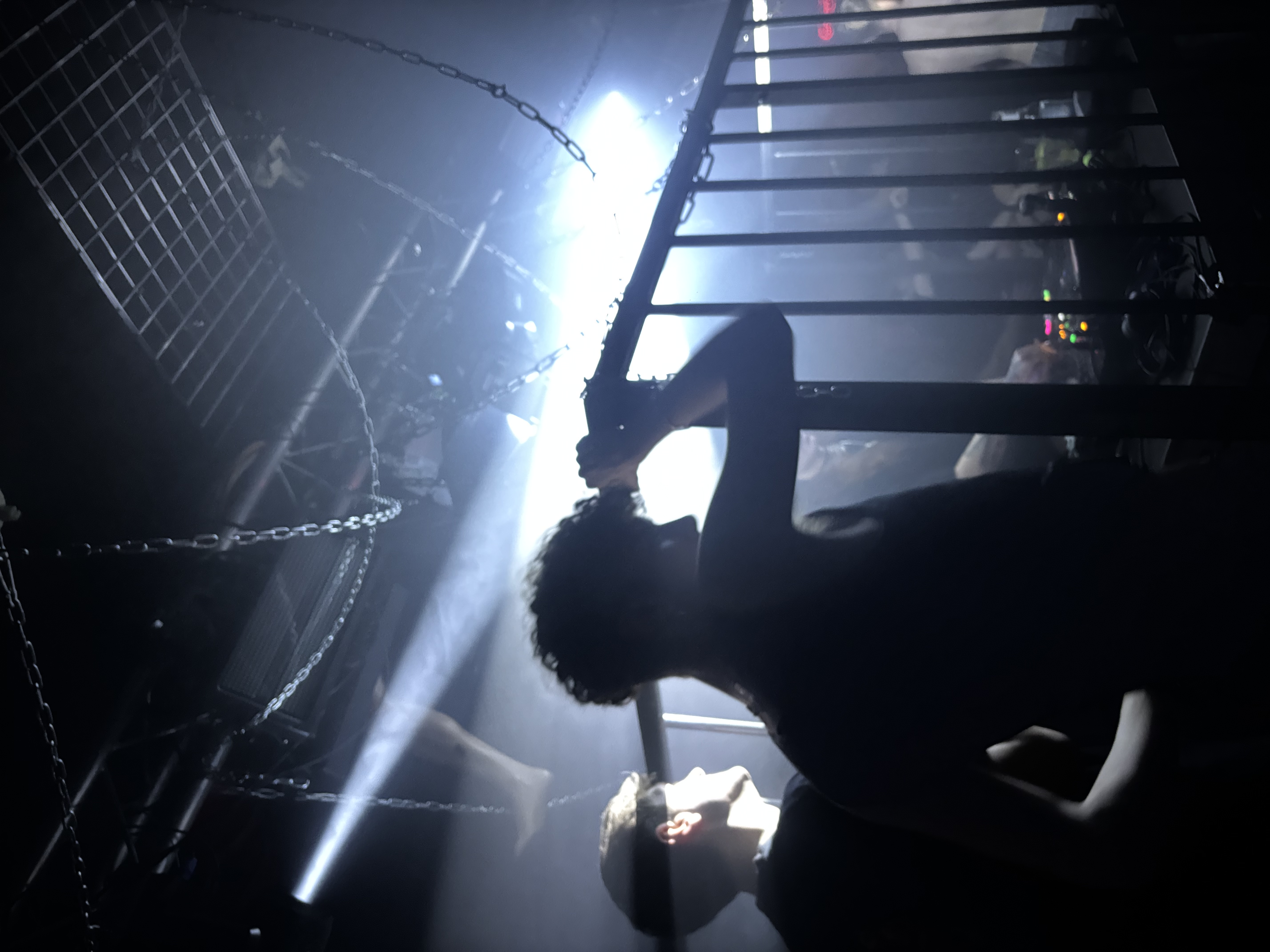 Dark warehouse party with laser beams